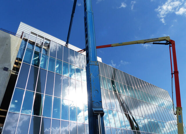 Target entrance building glass facades with steel cladding ongoing on high bay level