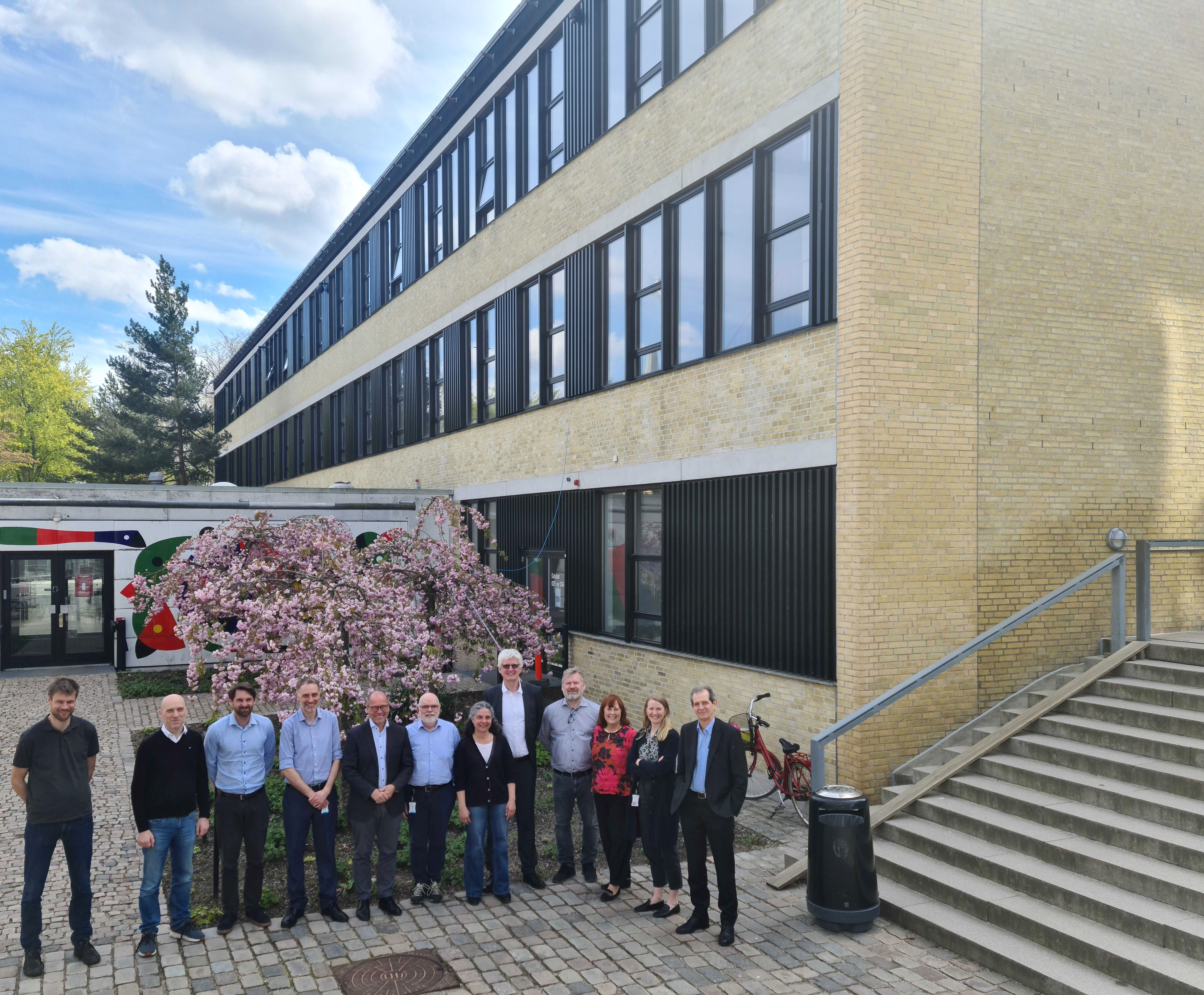 The DMSC Management Team and the ESS Executive Board outside DMSC offices