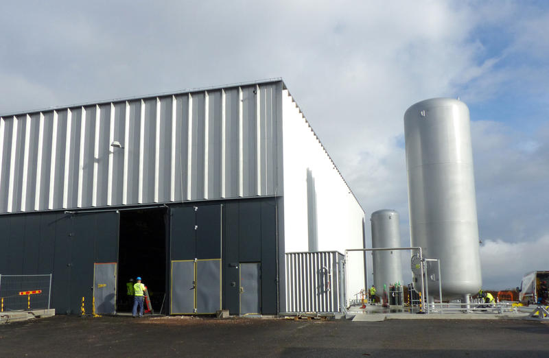 Helium storage tanks rising 9 metres.