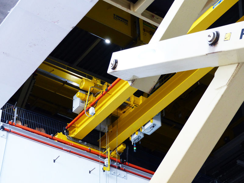 Commissioning of the high bay crane is in progress.